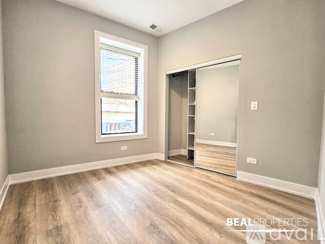 A room with a sliding door and a window.