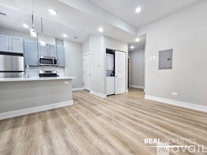 A kitchen area with a counter and cabinets.