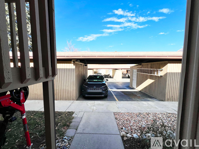 A view from a balcony looking into a parking garage.