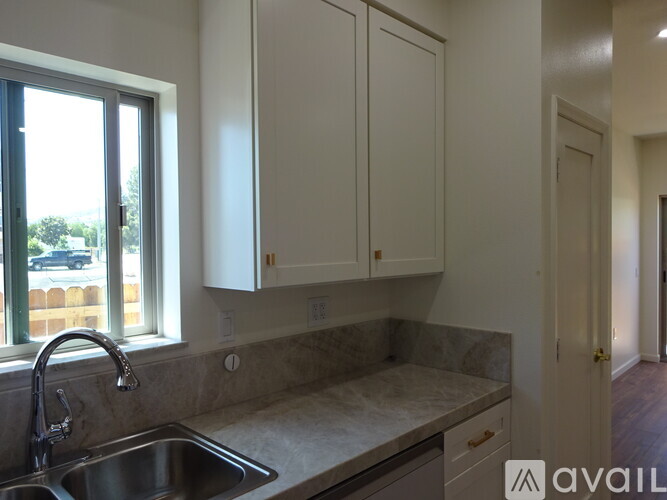 A kitchen with a sink and cabinets.