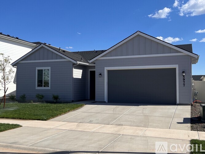 A two-car garage is attached to a house.