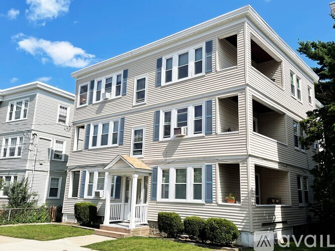 A row of houses with a sign that says "AVAILABLE" in front of the first one.