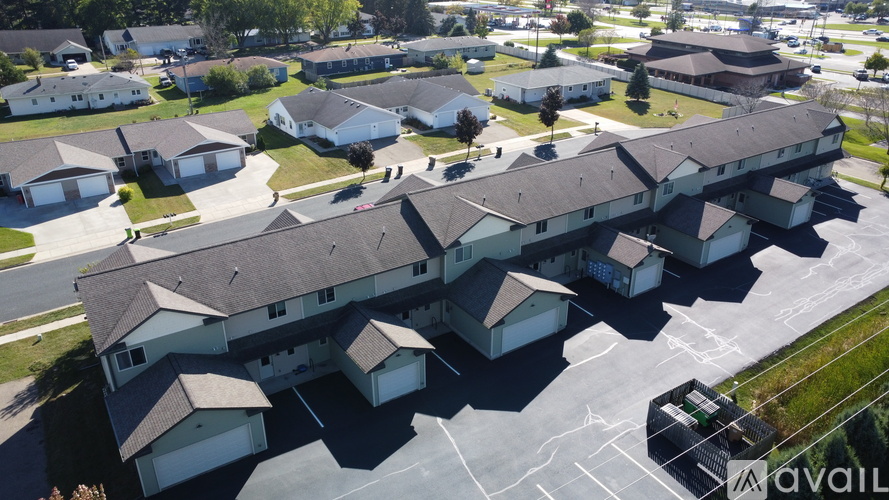 A large apartment complex with multiple buildings and parking lots.
