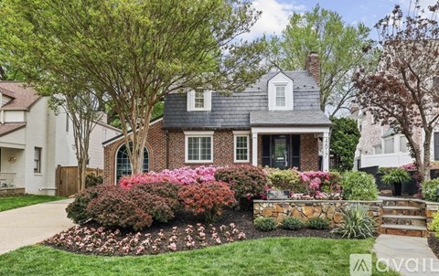 A house with a garden in front of it.