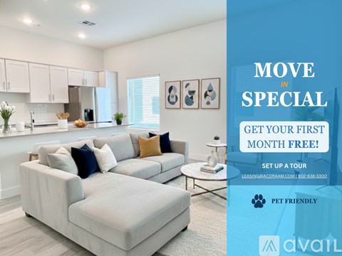A living room with a couch and a sign offering a free first month for a move in special.