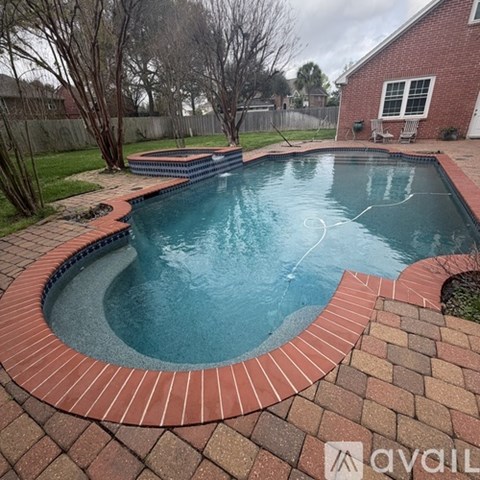 A small round pool with a brick border.