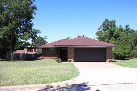 A house with a garage is for sale.