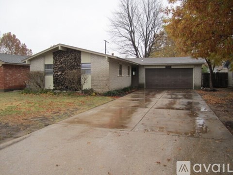 A house with a garage and a driveway.