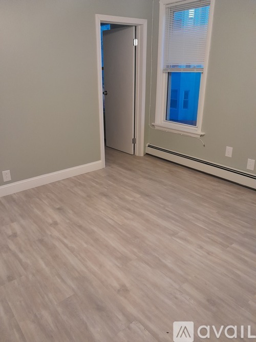 A room with a door and a window.
