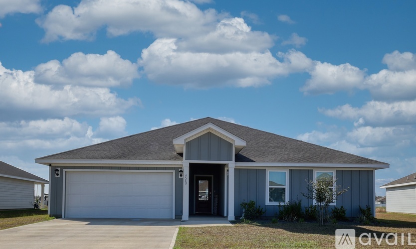 A house with a garage is available for sale.