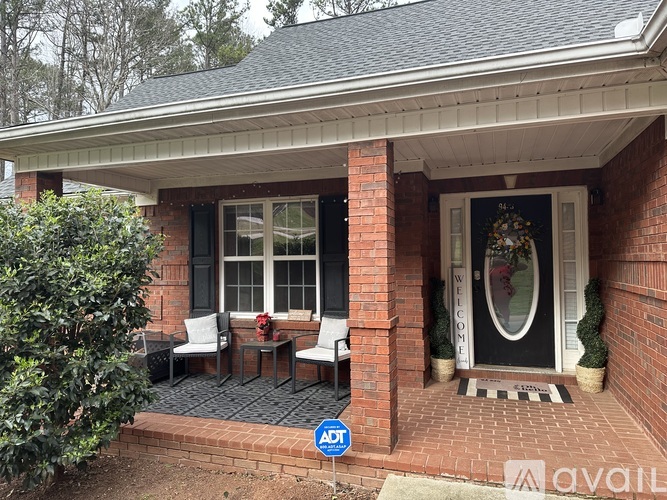 A house with a front porch and a sign that says "Available".