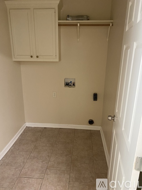 A white door is on the right side of the image.