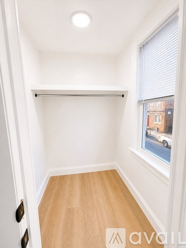 A small room with a sliding door and a window.
