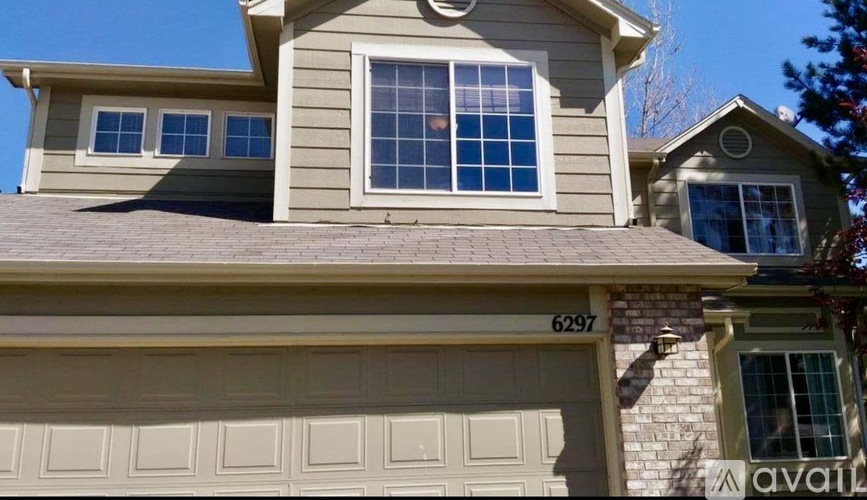 A house with the number 6297 on the garage door.