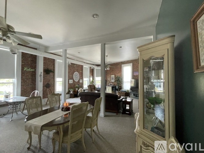 A dining room with a table and chairs is shown.