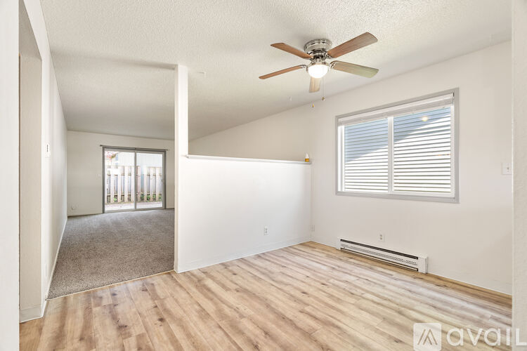 A room with a window and a wall-mounted air conditioner unit.