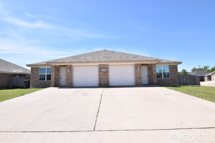 A house with a garage is available for sale.