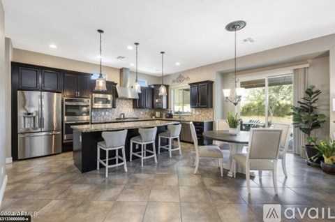 A modern kitchen with a dining table set for four.