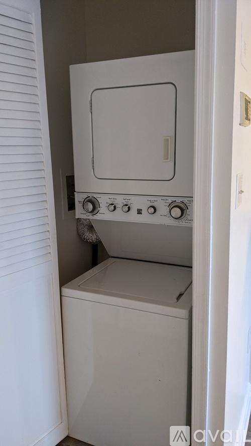 A white oven and dishwasher in a small kitchen.