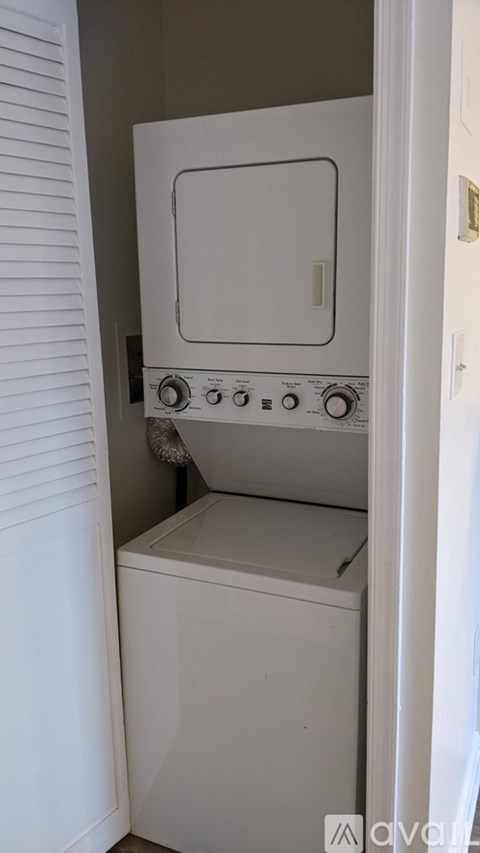 A white oven and dishwasher in a small kitchen.