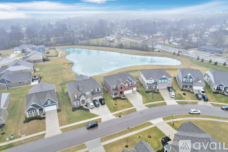 A suburban neighborhood with houses and a swimming pool.