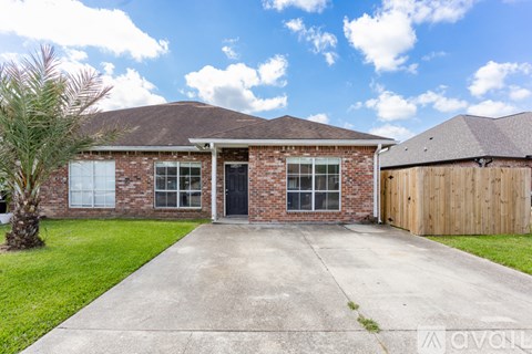 A house with a driveway in front of it.