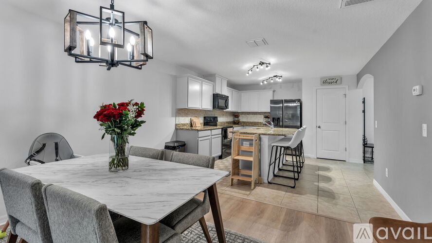 A dining area with a table and chairs is available for rent.