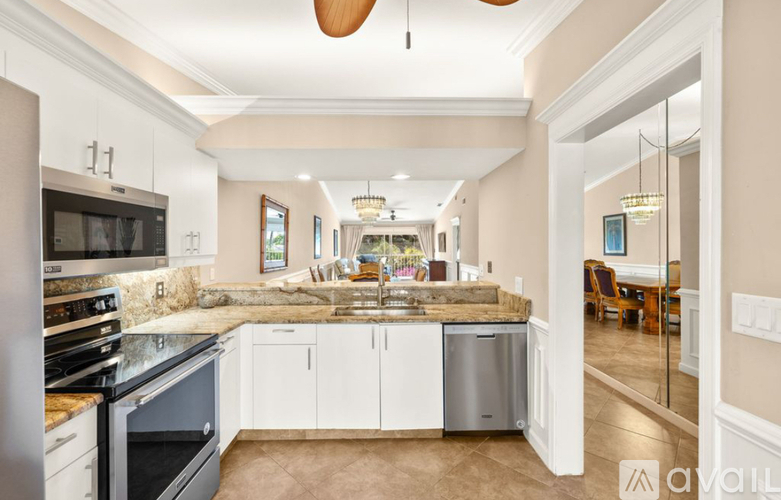 A kitchen with a stove top oven and a dishwasher.