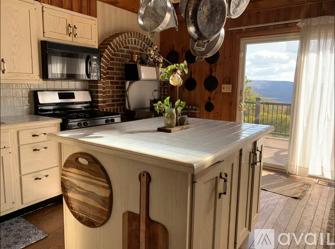 A kitchen with wooden cabinets and a white countertop.