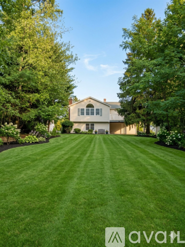 A house with a lawn in front of it.