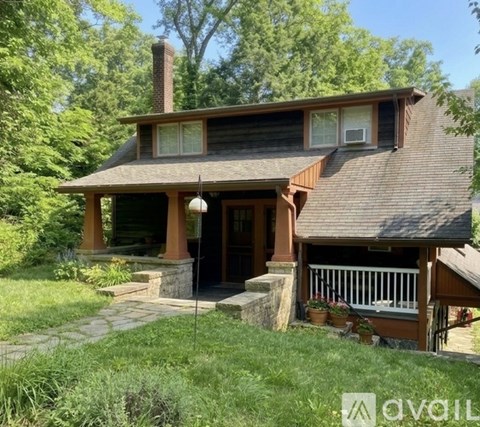 A house with a porch and a covered entrance.
