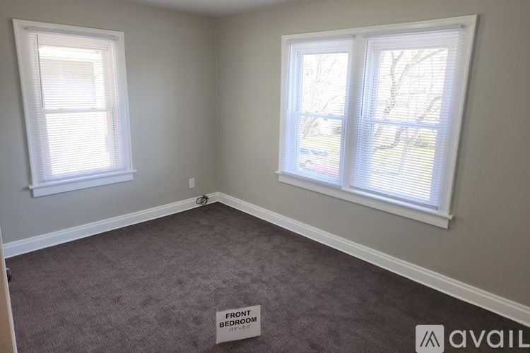 A room with a sign that says "Front Bedroom".