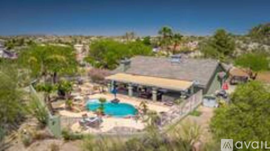 A house with a pool in the desert.