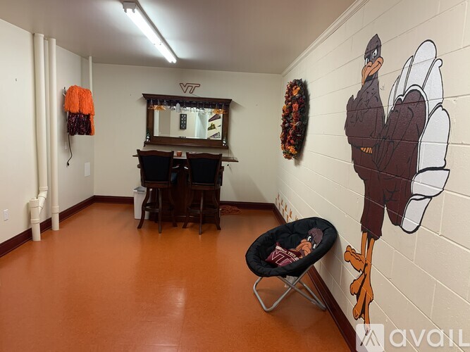 A room with a turkey mural on the wall.