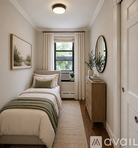 A bedroom with a bed, a dresser, and a mirror.