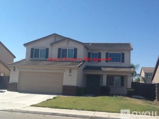 A house with a sign that says "Liberty Property Management".