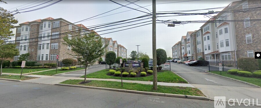A street view of a residential area with apartment buildings on both sides.
