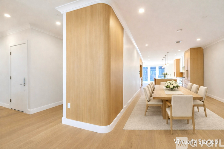A dining room with a table set for six.