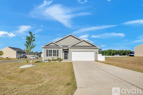A house with a garage is available for sale.