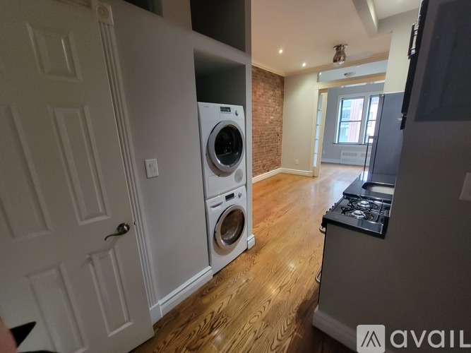 A laundry room with a washer and dryer in it.