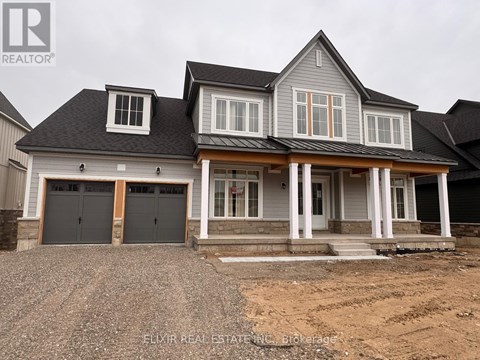 A house with a grey roof and a white garage door.