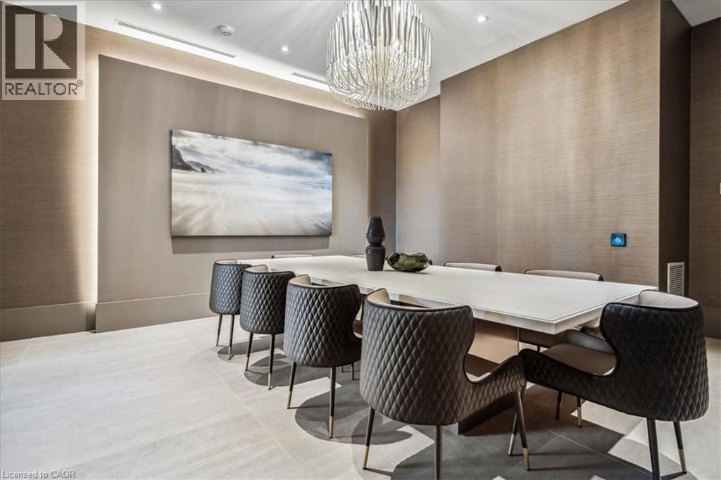 A conference room with a long table and chairs.