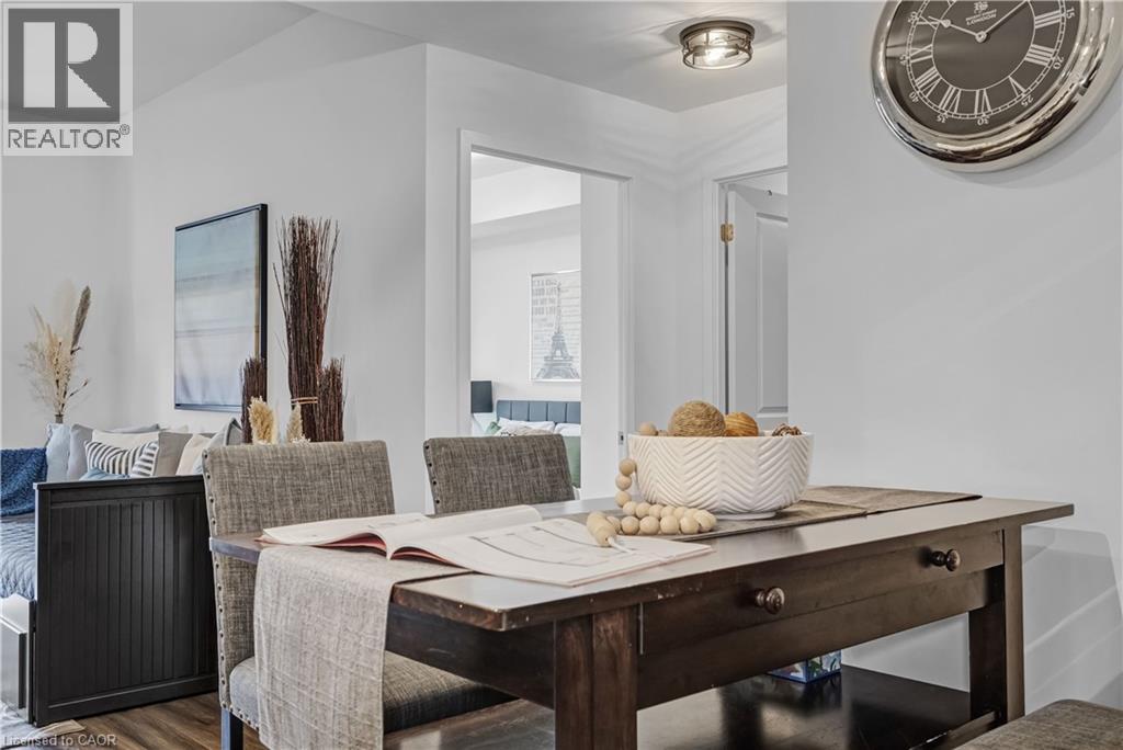 A dining room with a wooden table and chairs.