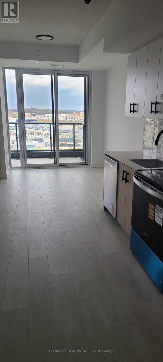 A kitchen with a view of the city.