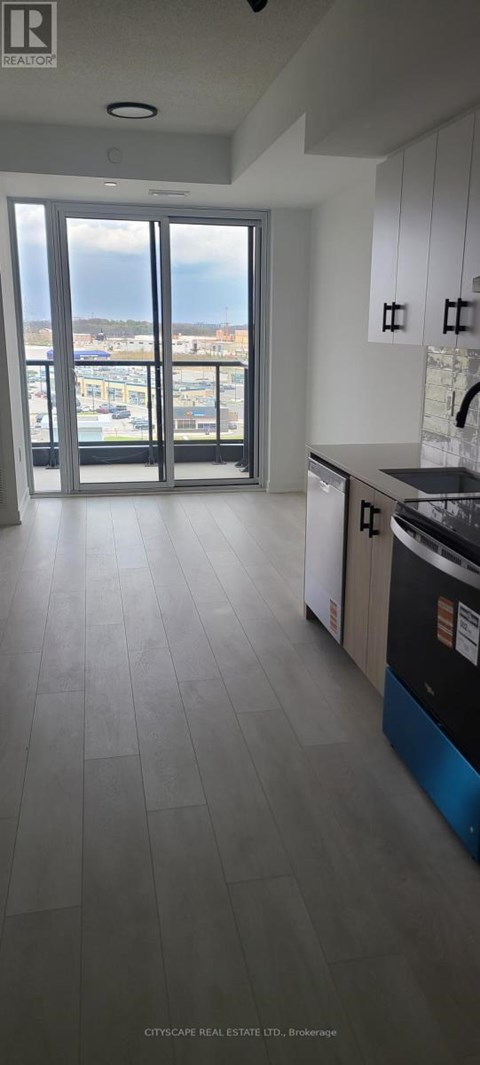 A kitchen with a view of the city.