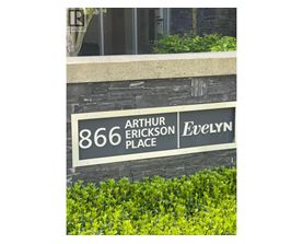 A sign that says "Arthur Erickson Place" in front of a building.
