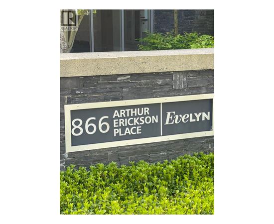 A sign that says "Arthur Erickson Place" in front of a building.