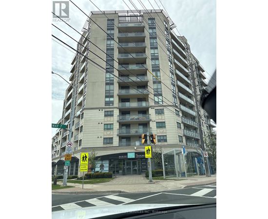 A tall building with a crosswalk in front of it.