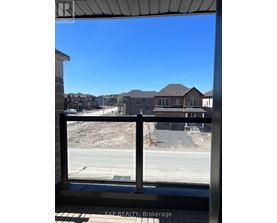 A real estate sign is on the window of a building.