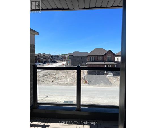 A real estate sign is on the window of a building.